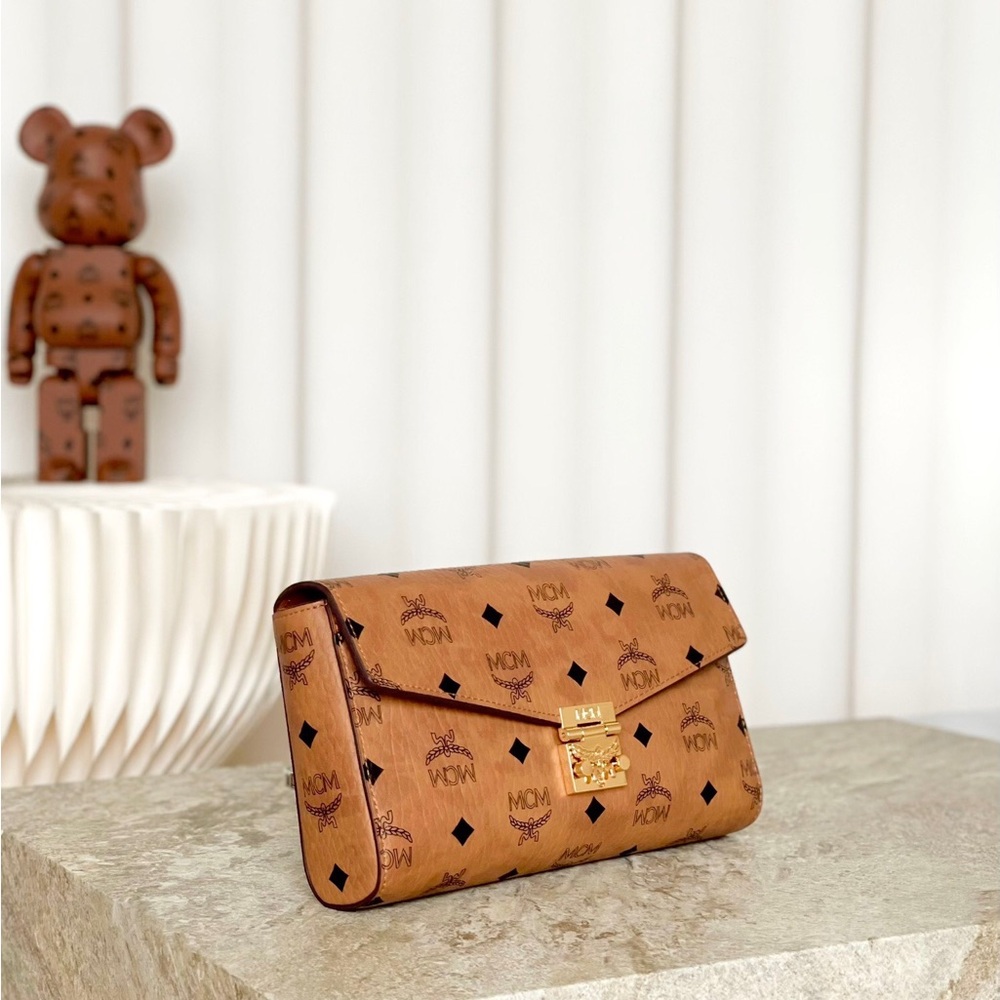 MCM Tan Monogram Clutch with Gold Accent - Picture 2 of 9